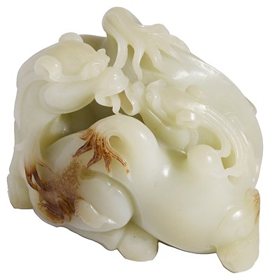 Lot 46 - A CHINESE CARVED CELADON JADE RECUMBENT CAMEL GROUP