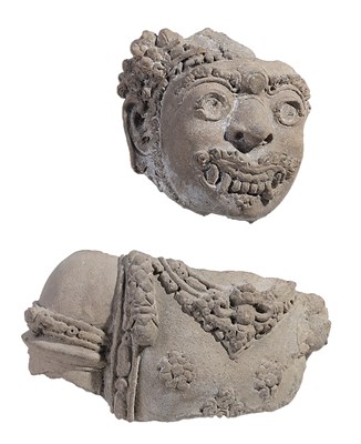 Lot 84 - A MAJAPAHIT FRAGMENTARY TERRACOTTA FIGURE OF A DVARAPALA