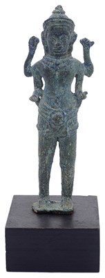 Lot 87 - A SMALL KHMER BRONZE FIGURE OF A FOUR-ARMED DEITY
