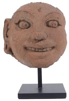 Lot 92 - A MAJAPAHIT FRAGMENTARY TERRACOTTA HEAD OF A GANA