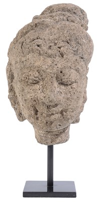 Lot 93 - A MAJAPAHIT CARVED PUMICE HEAD OF A DEITY