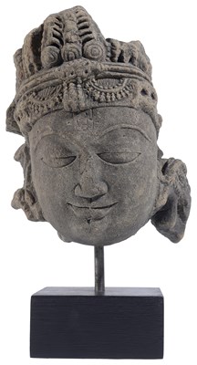 Lot 115 - A BUFF SANDSTONE HEAD OF A DEITY
