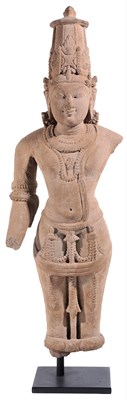 Lot 119 - A PINKISH BUFF SANDSTONE FIGURE OF VISHNU