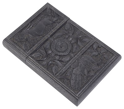 Lot 194 - ËœA CARVED EBONY CARD CASE