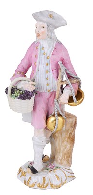 Lot 292 - A GERMAN 'CRIS DE PARIS' SERIES PORCELAIN FIGURE OF A GRAPE SELLER