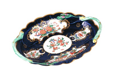 Lot 45 - A SMALL WORCESTER BLUE GROUND TWO-HANDLED DISH