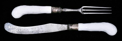 Lot 58 - A PAIR OF BOW WHITE KNIFE AND FORK HANDLES