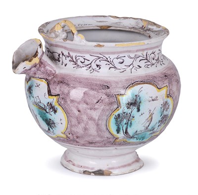 Lot 83 - AN ITALIAN FAIENCE SPOUTED POT
