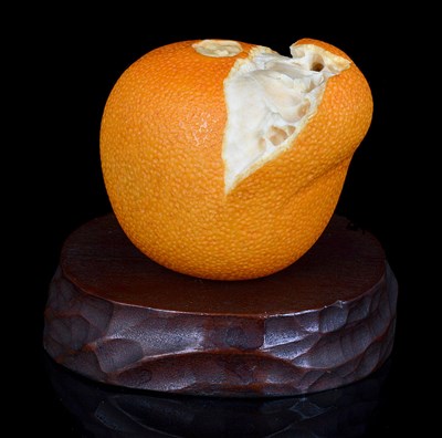 Lot 142 - A JAPANESE IVORY OKIMONO OF AN ORANGE