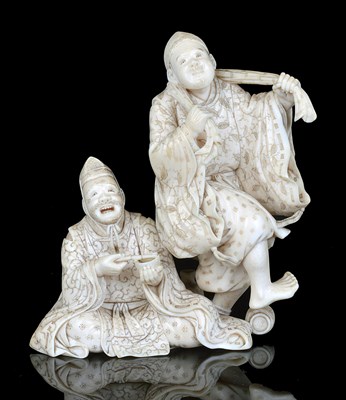 Lot 162 - A JAPANESE IVORY OKIMONO GROUP OF A PAIR OF ENTERTAINERS