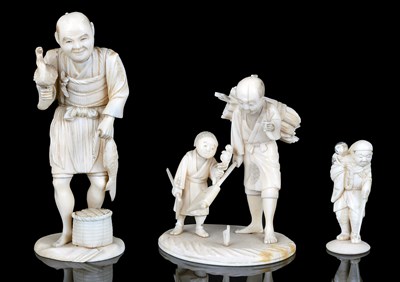 Lot 177 - A JAPANESE SECTIONAL IVORY OKIMONO GROUP OF A WOODSMAN