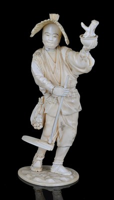 Lot 183 - A SECTIONAL IVORY OKIMONO OF A FARMER