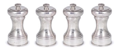 Lot 318 - A SET OF FOUR SILVER PEPPER MILLS