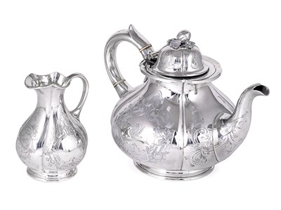 Lot 360 - A VICTORIAN SILVER SET OF A TEAPOT AND A MILK JUG