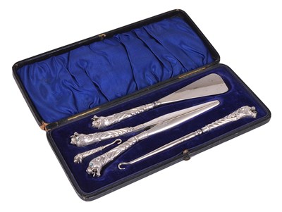 Lot 416 - A VICTORIAN SILVER-MOUNTED BOOT AND GLOVE SET