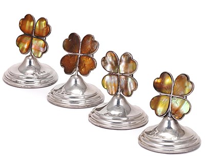 Lot 417 - A SET OF FOUR GEORGE V SILVER 'FOUR-LEAF CLOVER' CARD HOLDERS