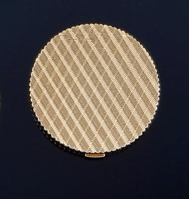 Lot 427 - A GOLD COMPACT