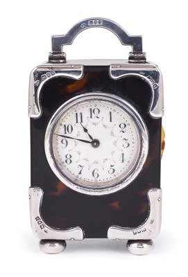 Lot 443 - AN EDWARDIAN SILVER-MOUNTED TORTOISESHELL CARRIAGE TIMEPIECE