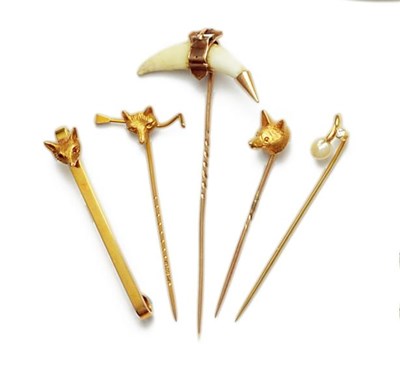 Lot 457 - FOUR GOLD STICK PINS AND A BAR CLIP