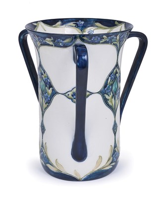 Lot 44 - FORGET-ME-NOTS: A TALL MOORCROFT MACINTYRE THREE-HANDLED VASE