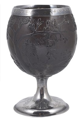 Lot 153 - A SILVER-MOUNTED CARVED COCONUT CUP
