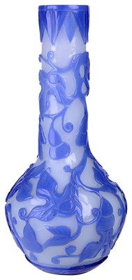 Lot 16 - â€¡ A CHINESE BLUE OVERLAID WHITE GLASS BOTTLE VASE