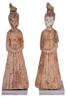 Lot 22 - A PAIR OF CHINESE POTTERY FIGURES OF FEMALE ATTENDANTS