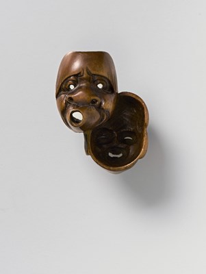 Lot 45 - A JAPANESE DOUBLE MASK NETSUKE OF OKAME AND USOBUKI
