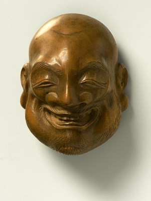 Lot 53 - A JAPANESE MASK NETSUKE OF A LAUGHING MAN