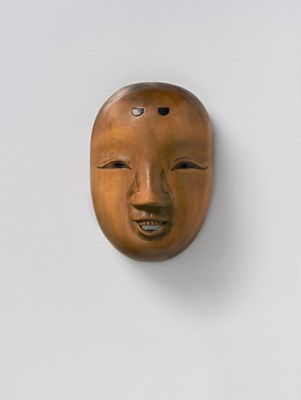 Lot 74 - A JAPANESE MASK NETSUKE OF A SMILING FEMALE
