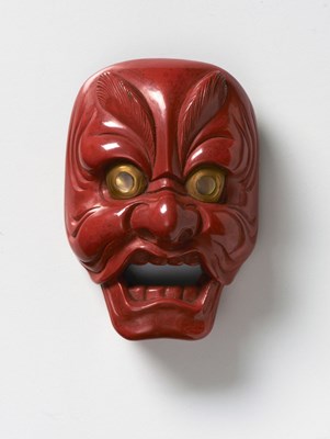 Lot 85 - A JAPANESE MASK NETSUKE OF GENJORAKU