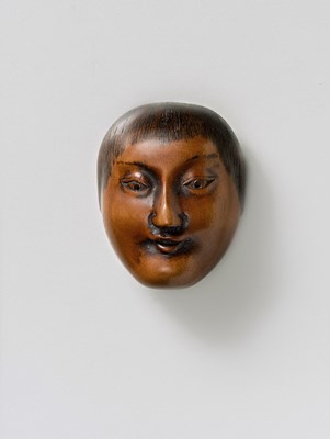 Lot 90 - A JAPANESE MASK NETSUKE OF SHOJO