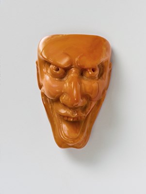 Lot 96 - A JAPANESE MASK NETSUKE OF KUROHIGE