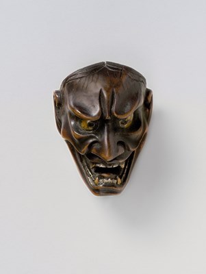 Lot 100 - A JAPANESE MASK NETSUKE OF SHIKAMI