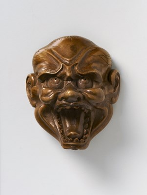 Lot 102 - A JAPANESE MASK NETSUKE OF SHISHIGUCHI