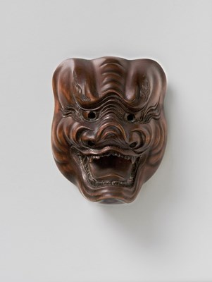 Lot 104 - A JAPANESE MASK NETSUKE OF SHISHIGUCHI
