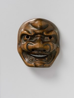 Lot 108 - A JAPANESE MASK NETSUKE OF SHISHIGUCHI