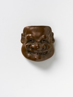 Lot 115 - A JAPANESE MASK NETSUKE OF BUAKU