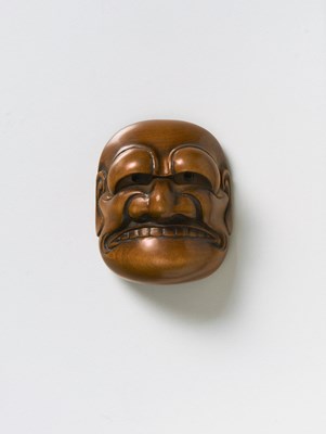 Lot 117 - A JAPANESE MASK NETSUKE OF BUAKU