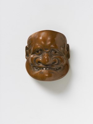 Lot 118 - A JAPANESE MASK NETSUKE OF BUAKU
