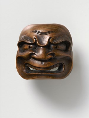 Lot 119 - A JAPANESE MASK NETSUKE OF BUAKU