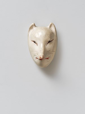 Lot 121 - A JAPANESE MASK NETSUKE OF KITSUNE