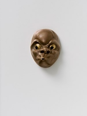 Lot 128 - A JAPANESE MASK NETSUKE OF USOBUKI