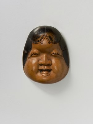 Lot 130 - A JAPANESE MASK NETSUKE OF OTO
