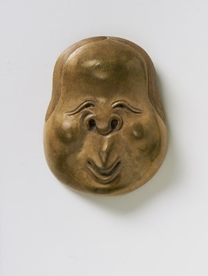 Lot 132 - A JAPANESE MASK NETSUKE OF OTO