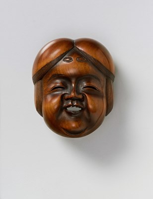 Lot 137 - A JAPANESE MASK NETSUKE OF OKAME