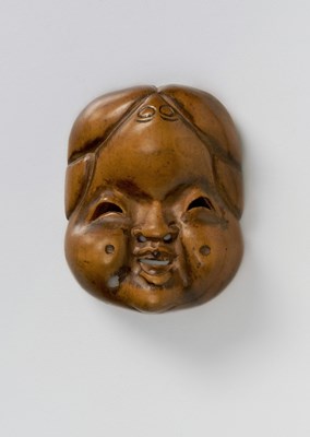 Lot 140 - A JAPANESE MASK NETSUKE OF OKAME