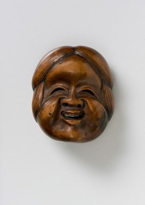 Lot 141 - A JAPANESE MASK NETSUKE OF OKAME