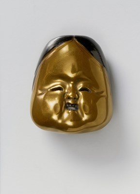 Lot 142 - A JAPANESE MASK NETSUKE OF OKAME