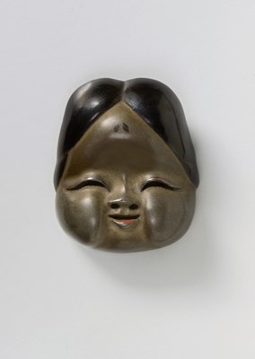 Lot 143 - A JAPANESE MASK NETSUKE OF OKAME